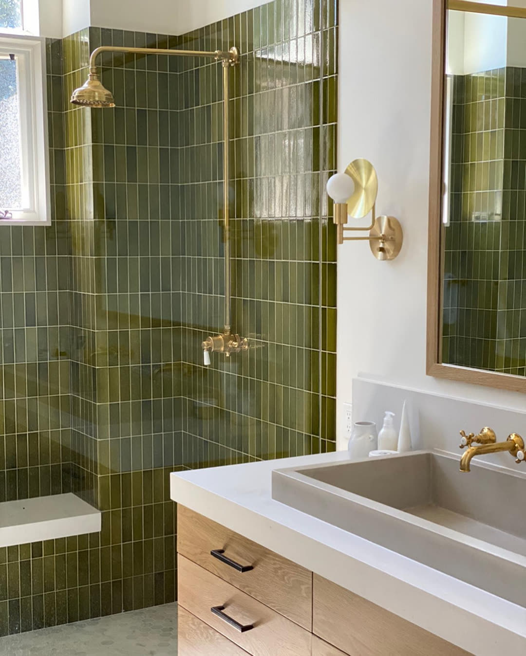 Illustrative placeholder image of a white tile walk-in shower with brass fixtures